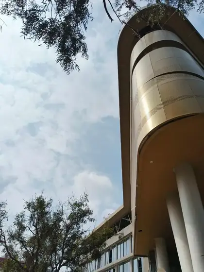 Perforated screen on a curved corner