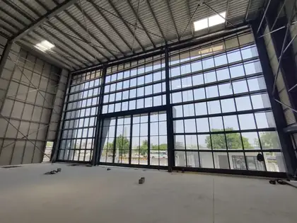 Curtain wall from inside the PEB frame