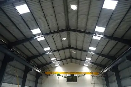 Shed interior with roof lights and crane beam